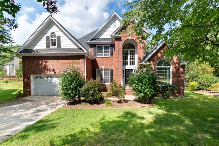 Brick home and landscaped front garden